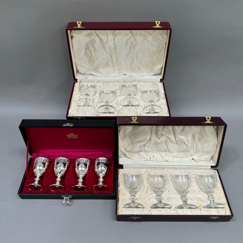 106 - Two cased commemorative sets of etched glasses and a plated set