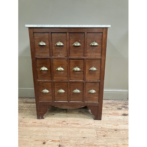 341 - An early 20th century mahogany filing cabinet of twelve drawers with brass cup handles and associate... 