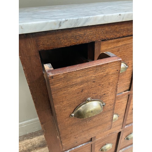 341 - An early 20th century mahogany filing cabinet of twelve drawers with brass cup handles and associate... 