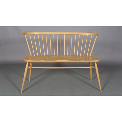 40 - An Ercol 'Originals' blonde love seat, with stick back, decal to underside, 112cm wide, 82cm high an... 