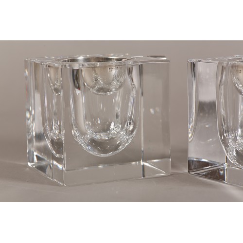 51 - Ercuis, France, A pair of clear ashtrays of cuboid form with silver plated dished liners, 9cm