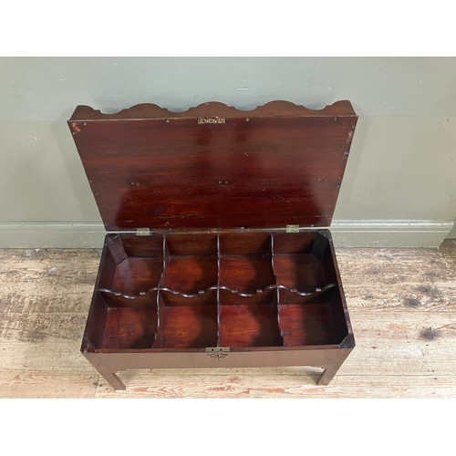 323 - A mahogany tray top box, the hinged lid having eight divisions with ogee side panels and an arched c... 