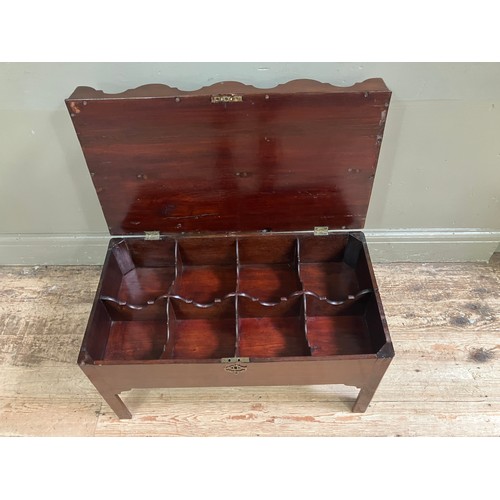 323 - A mahogany tray top box, the hinged lid having eight divisions with ogee side panels and an arched c... 