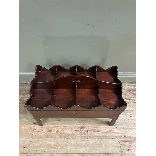 323 - A mahogany tray top box, the hinged lid having eight divisions with ogee side panels and an arched c... 