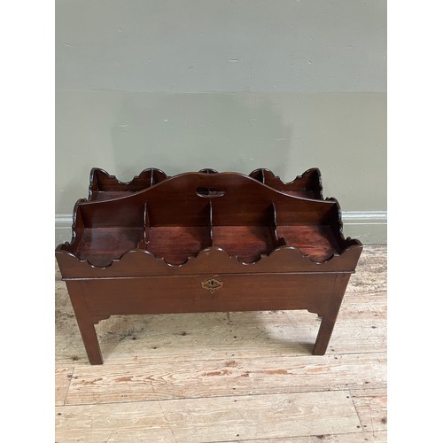 323 - A mahogany tray top box, the hinged lid having eight divisions with ogee side panels and an arched c... 