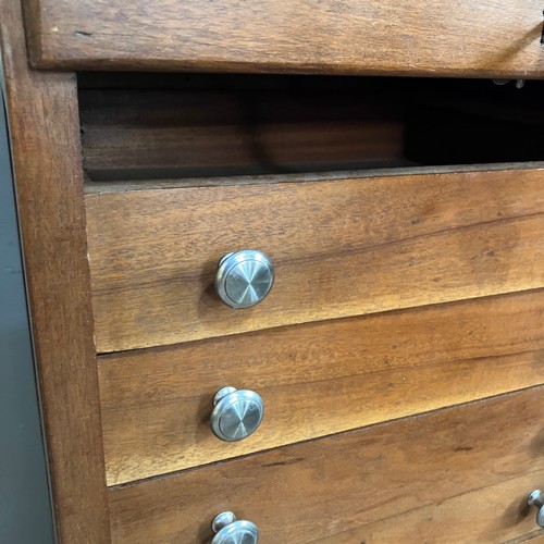 342 - A 20th century beech and mahogany music cabinet with tambour front and on plinth base, 50.5cm wide, ... 