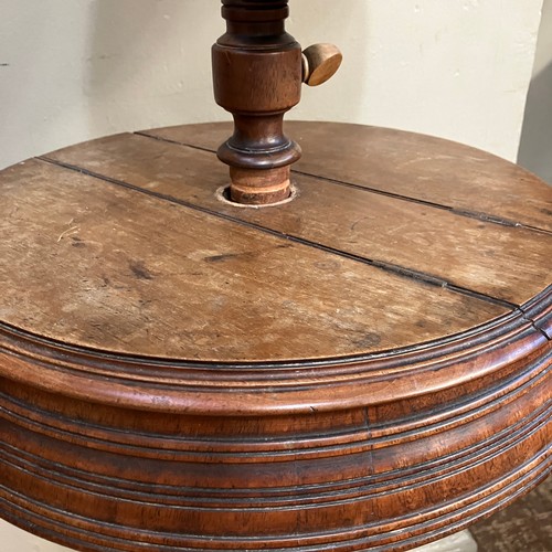 352 - A 19th century mahogany shaving mirror on turned support and tripod base