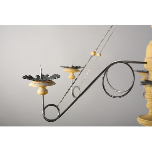 36 - A 16th century Italian design inspired ceiling light in cream wood and scrolled metal with six arms ... 