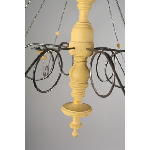 36 - A 16th century Italian design inspired ceiling light in cream wood and scrolled metal with six arms ... 