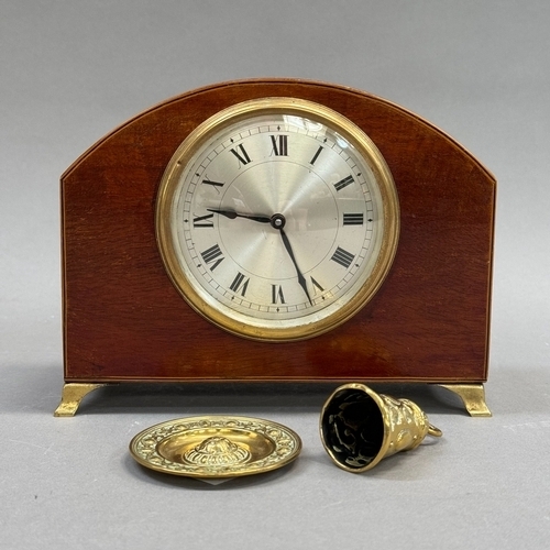 40 - An Edwardian mahogany mantel clock inlaid with box wood and ebony stringing, arched profile on brass... 