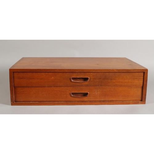 144 - A teak nest of two shallow drawers with recessed handles, 61cm wide x 38cm deep x 16cm high