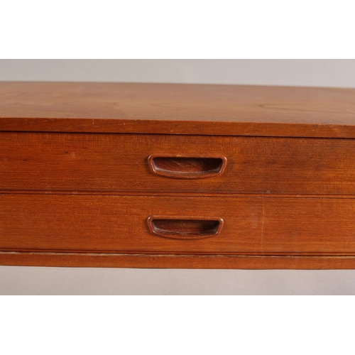 144 - A teak nest of two shallow drawers with recessed handles, 61cm wide x 38cm deep x 16cm high