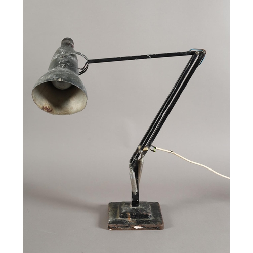 38 - A modernist angle poise desk lamp by Herbert Terry and Sons, Redditch, black enamel, on a two tier s... 