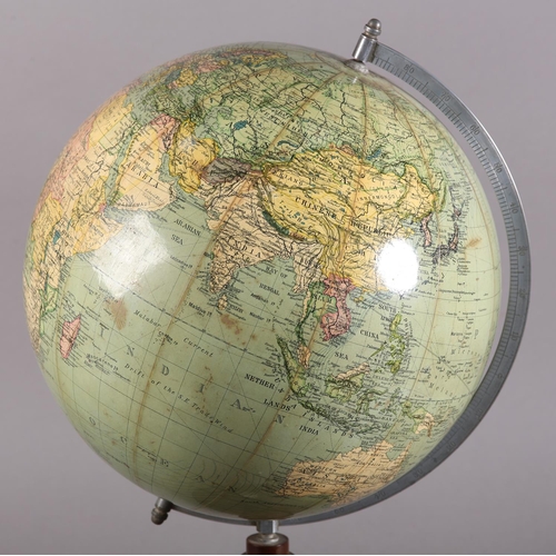 72 - A terrestrial globe, c1930s, with metal semi-meridian, the wooden circular base inset with a compass... 