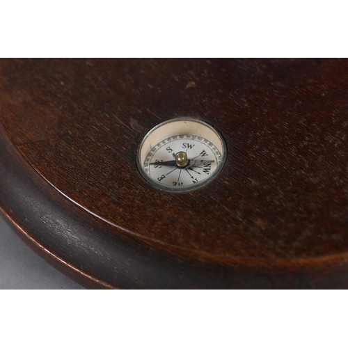 72 - A terrestrial globe, c1930s, with metal semi-meridian, the wooden circular base inset with a compass... 