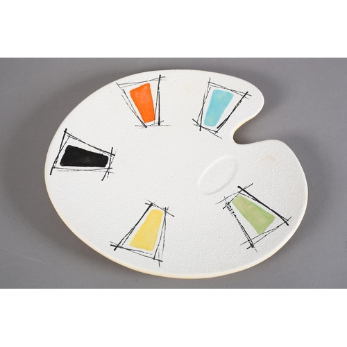 89 - An early 1960s studio pottery artist's palette dish, polychrome glazed, the underside yellow and pai... 