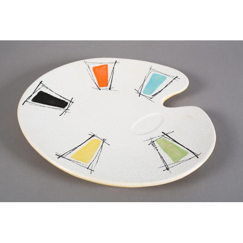 89 - An early 1960s studio pottery artist's palette dish, polychrome glazed, the underside yellow and pai... 