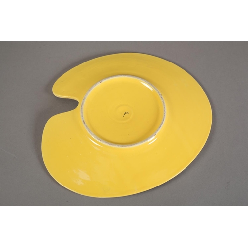 89 - An early 1960s studio pottery artist's palette dish, polychrome glazed, the underside yellow and pai... 