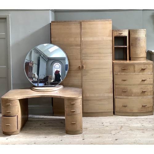 267 - An Art Deco walnut bedroom suite, comprising a dressing table with large circular mirror and two ban... 