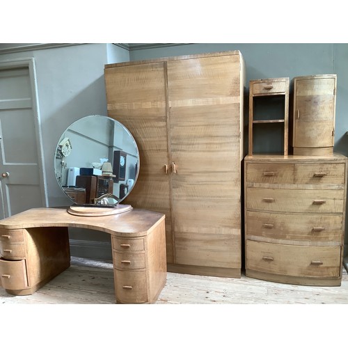 267 - An Art Deco walnut bedroom suite, comprising a dressing table with large circular mirror and two ban... 