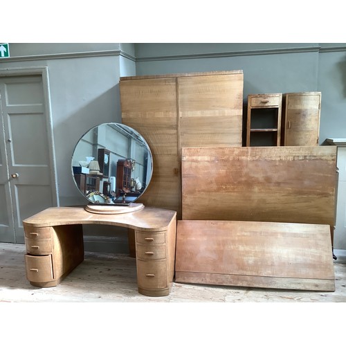 267 - An Art Deco walnut bedroom suite, comprising a dressing table with large circular mirror and two ban... 