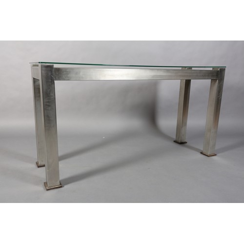 123 - A matt stainless steel console, rectangular, inset with a cast iron open grid, with glass surface 16... 