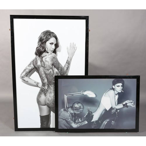 138 - Two black and white photographic prints, three quarter portrait of a tattooed woman and of a tattooi... 