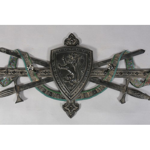 127 - A Victorian cast iron Scottish Baronial hat and coat rack formed as crossed swords and riband motto ... 