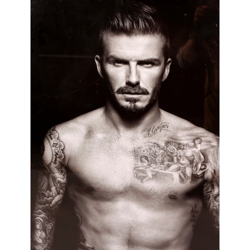 139 - A black and white photographic print of David Beckham, 126cm x 91cm with frame