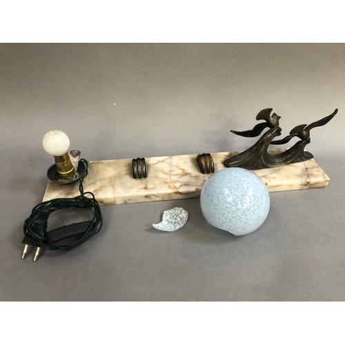 200 - An Art Deco style desk stand of marble having a model of two bronze birds to one edge and a globe li... 