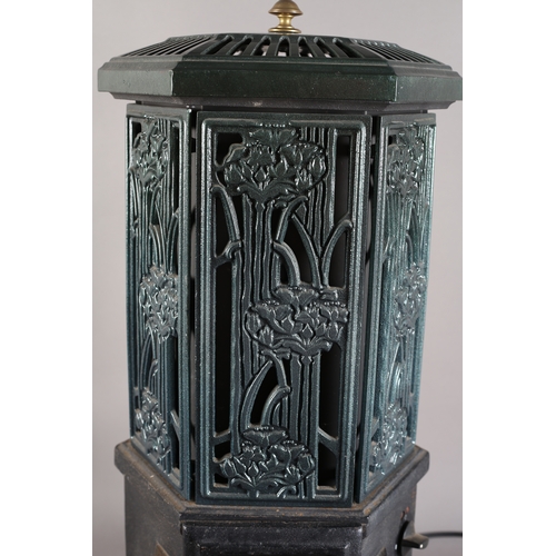 141 - An Esse cast iron and enamel electric stove of hexagonal outline with pierced foliate panels, 73cm h... 