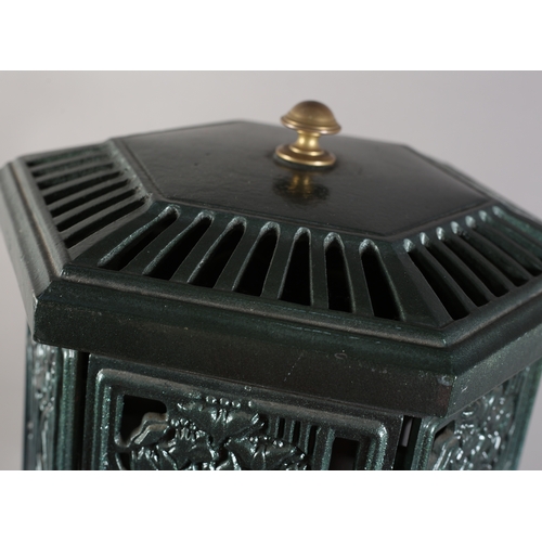 141 - An Esse cast iron and enamel electric stove of hexagonal outline with pierced foliate panels, 73cm h... 