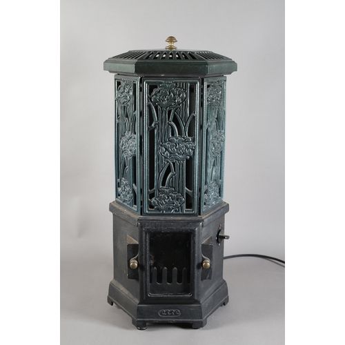 141 - An Esse cast iron and enamel electric stove of hexagonal outline with pierced foliate panels, 73cm h... 