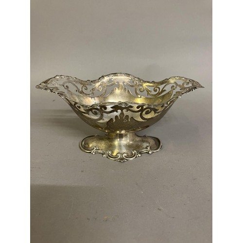 245 - An Edward VII silver pedestal dish of boat shape with pierced rim, Birmingham 1905, Walker & Hall, a... 