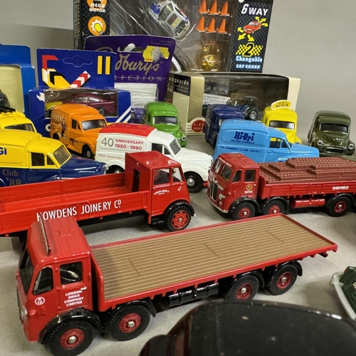 457 - A collection of 27 model cars from Corgi and Lledo, including 12 Morris Minor vans with various live... 