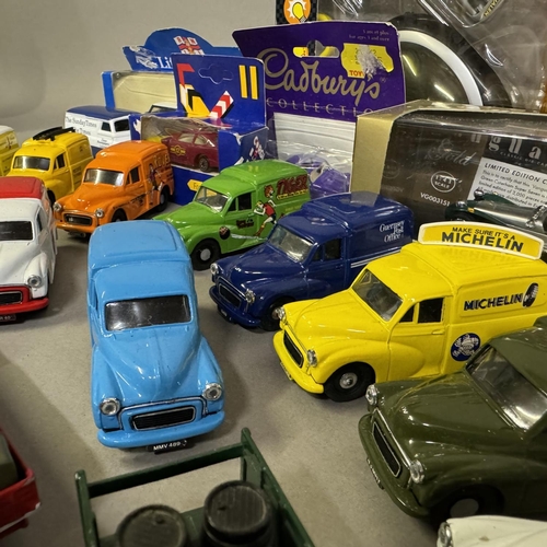 457 - A collection of 27 model cars from Corgi and Lledo, including 12 Morris Minor vans with various live... 