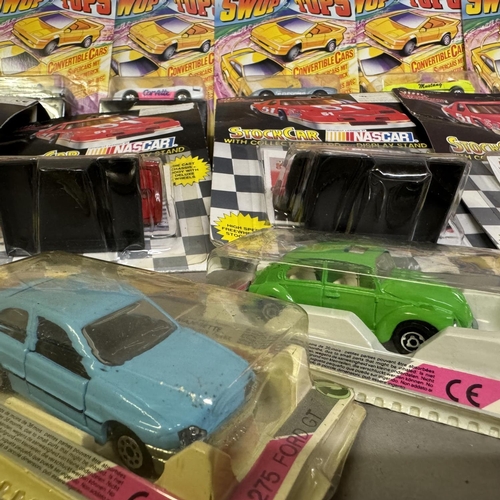 450 - A collection of six Matchbox Swop Tops cars including a Ferrari Testarossa and a Porsche 968, four R... 