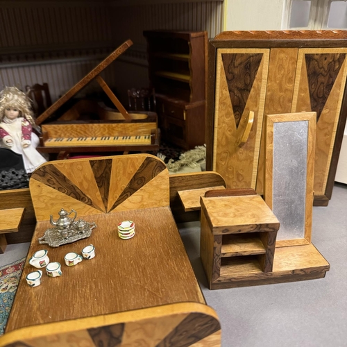 500 - A three-storey Edwardian style dolls house with opening front and roof, along with a quantity of fur... 