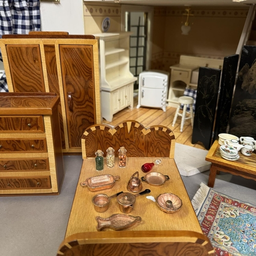 500 - A three-storey Edwardian style dolls house with opening front and roof, along with a quantity of fur... 