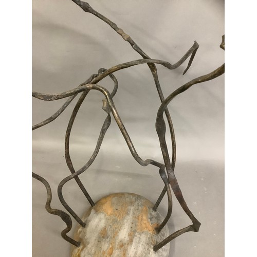 12B - A Spanish abstract sculpture circa 1960's, having tendrils issuing from a smooth carved base, 86cm h... 