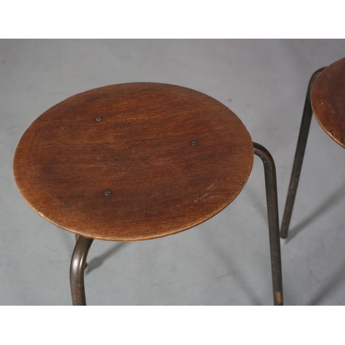 145 - Arne Jacobsen, a set of three 'Dot' stacking stools walnut veneered, circular seat on metal rod legs