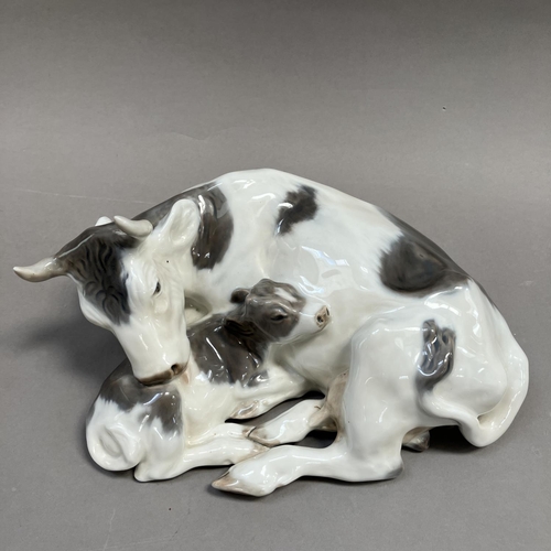 1 - A Royal Copenhagen group of cow and calf modelled by Knud Kyhn, no.800 and mark to underside, 27cm w... 