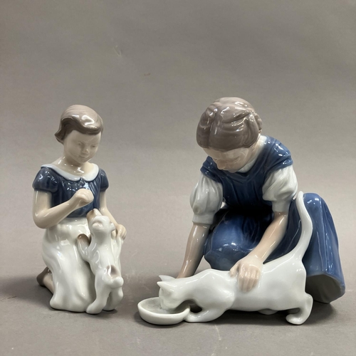 10 - Two Bing & Grondahl groups of a girl feeding a cat, no. 1745, 14cm high and a girl playing with a pu... 