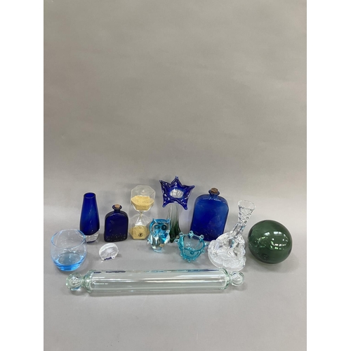 190 - A collection of 19th century and later glassware comprising a glass rolling pin, two blue moulded gl... 