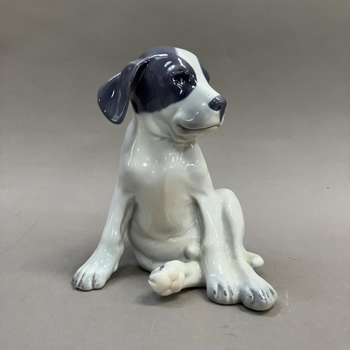 3 - A Royal Copenhagen model of a pointer puppy, modelled by Erik Nielsen, no. 051 and mark to underside... 