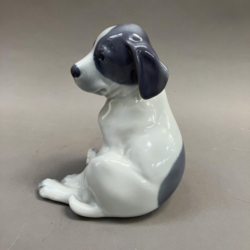 3 - A Royal Copenhagen model of a pointer puppy, modelled by Erik Nielsen, no. 051 and mark to underside... 