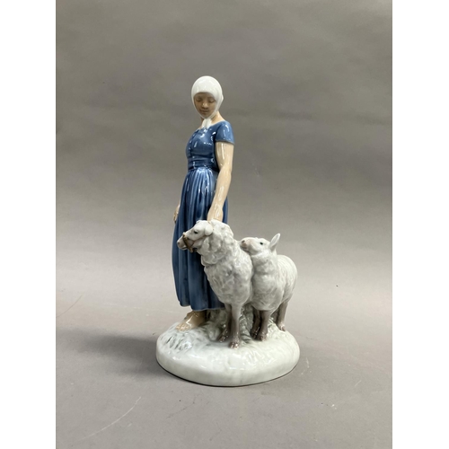 8 - A Bing & Grondahl group of girl with three sheep, modelled by Axel Locher, no. 2010 and mark to unde... 