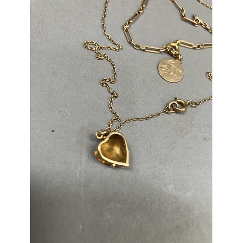 267 - A heart-shaped citrine pendant claw set in 9ct gold gallery mount hung on a fine trace link chain to... 