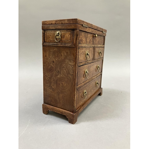 12 - An early 20th century burr walnut and satinwood veneered specimen chest, having a foldover top, twin... 