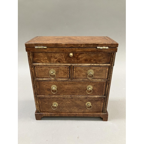 12 - An early 20th century burr walnut and satinwood veneered specimen chest, having a foldover top, twin... 